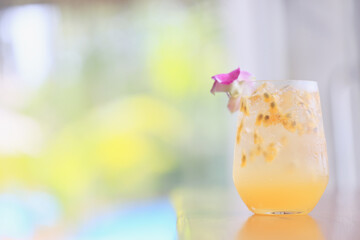 passion fruit lemonade background, cold lemonade in a glass, delicate texture cold tropical drink background