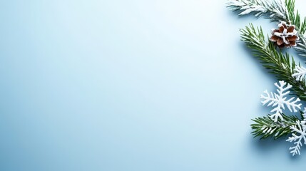 Obraz premium Festive Christmas decorations with pine branches pinecones and snowflakes on a light blue background