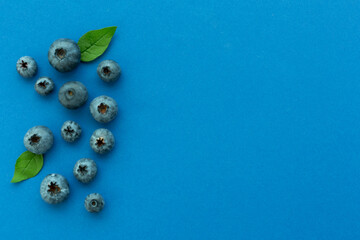 Fresh bright blueberries on color background,top view