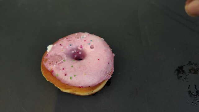 bagel with rose cream cheese , putting down