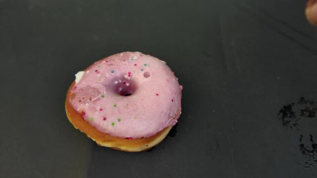 Rose bagel with cream cheese , falling down