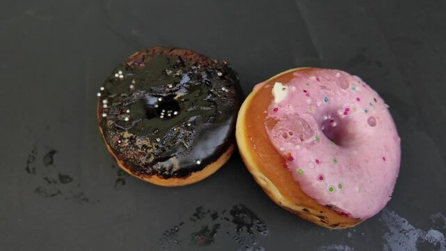 Chocolate and strawberry donuts super close up view