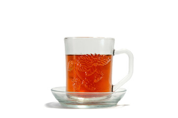 Glass cup of hot aromatic tea on isolated background.