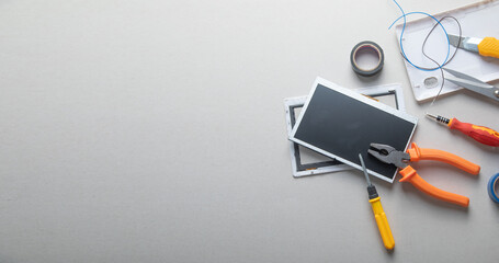 Various tools and broken tablet. Tablet repair