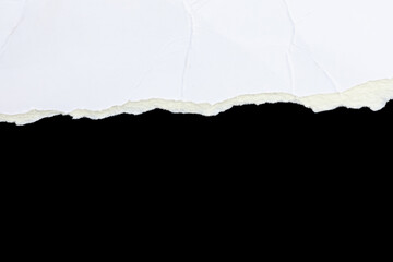 Fragmented Thoughts: Torn Paper on Black Surface
