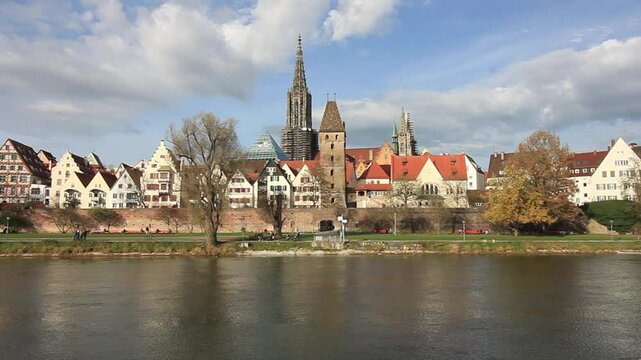 Skyline of Ulm, Germany, with the Ulm Minster towering above traditional half-timbered houses along the Danube River