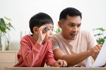 Activity of father and son engaging in hands-on learning with projects