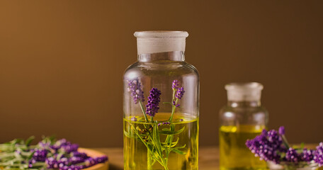 The glass bottle is carefully sealed. Inside contains shimmering golden essential oil and purple lavender plants. The essential oil is modulated by the traditional maceration method to fully extract.