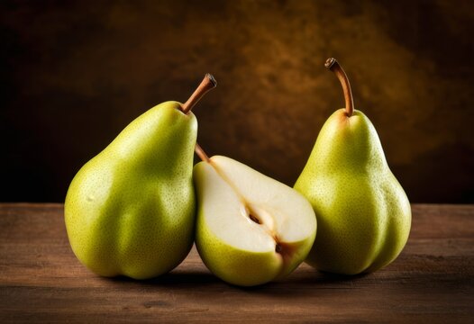 There are three pears sitting at a table - Powered by Adobe