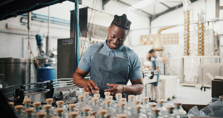 Distillery, bottle and export with man in factory for packaging, assembly line and supply chain...