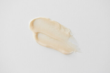 Beige hair conditioner or shampoo smear, skincare beauty product texture on white background