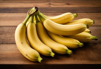 A pile of bananas sits on the wooden table