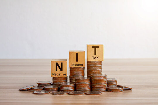 NIT Wooden blocks with words 'NEGATIVE INCOME TAX'. Business concept