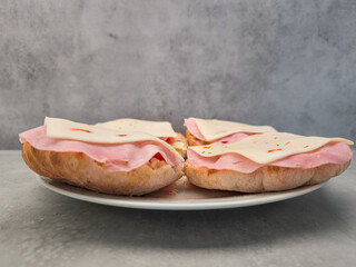 Pita bread sandwiches with ham and cheese waiting to be eaten copy space