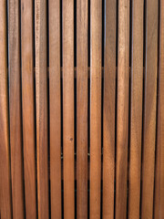 Vertical wooden slats creating repeating pattern on furniture copy space