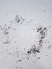 Soil forming a circle on white background, gardening and growth concept copy space