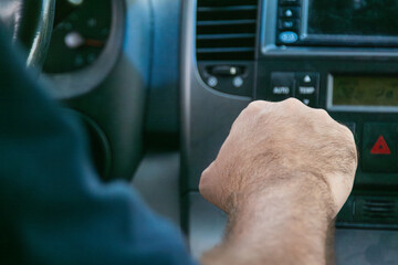 Driver shifting gears while driving minivan