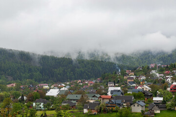 small mountain town on a foggy morning