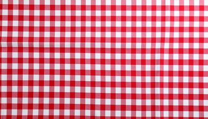Red white checkered picnic tablecloth as background, top view