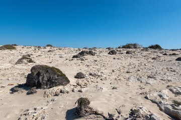 Rocky beach at Diakoftis on the southern part of the island of Karpathos, Greece.