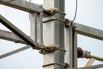 Closeup of railway mast for trolley system.