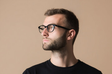 Obraz premium portrait of software engineer on left side of frame focused expression solid pastel background