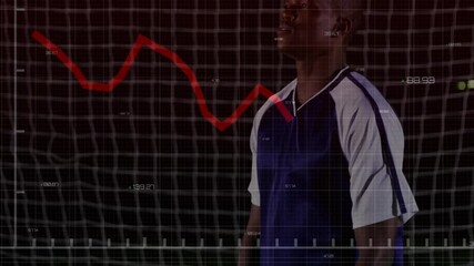 male athlete standing in soccer goal net grid, displaying red declining graph and floating numbers - Powered by Adobe