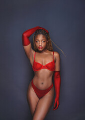  Sexy young woman on a dark background.