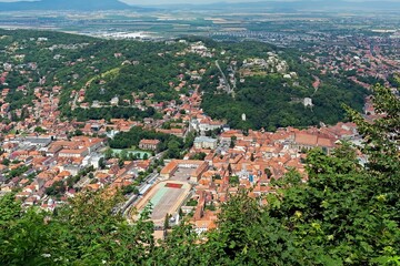 The aerial view to Brasov city in Romania from Muntele Tampa