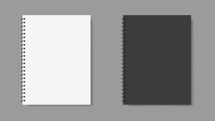 two spiral binder notebooks with black and white cover, place for text, gray background