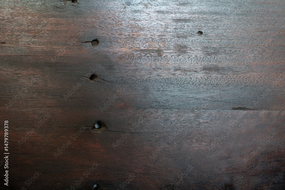 Poster high-resolution image of dark brown wood texture with several knot holes. perfect for backgrounds or