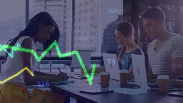 Three coworkers taking notes around office table, with translucent business line chart overlay
