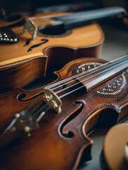 Fototapeta premium Close up shot of a violin and guitar musical instruments for music lovers and musicians
