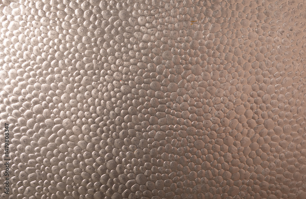 Poster High-resolution image of a metallic surface with a pebble texture. Ideal for backgrounds and design projects.