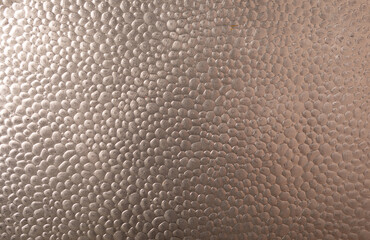 High-resolution image of a metallic surface with a pebble texture. Ideal for backgrounds and design...