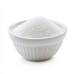 White sugar granules overflowing from a ceramic bowl studio shot on white background close up macro view