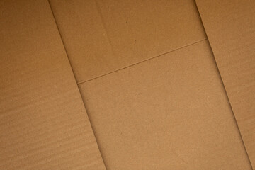 High-resolution image of brown cardboard texture. Perfect for backgrounds, packaging designs, and more.