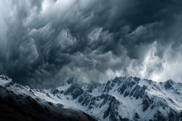 Obraz premium Dramatic storm clouds over a rugged mountain range