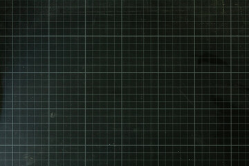 Plakat High-resolution image of a dark green cutting mat with a grid pattern. Perfect for backgrounds or textures.