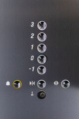 High-quality stock photo of a sleek elevator button panel with numbered buttons and control icons.