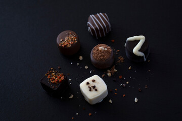 Various types of chocolate on black background