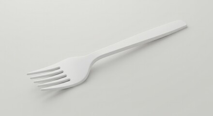 Minimalist white fork isolated on off-white backdrop for culinary representation