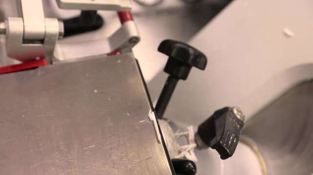 Cyclic motion of a cryostat microtome cutting frozen tissue for rapid intraoperative histology. Preparation of ultrathin sections for microscopic examination.