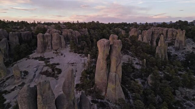 Rock formations and forest landscape at Valle de los Monjes, Chihuahua at sunset