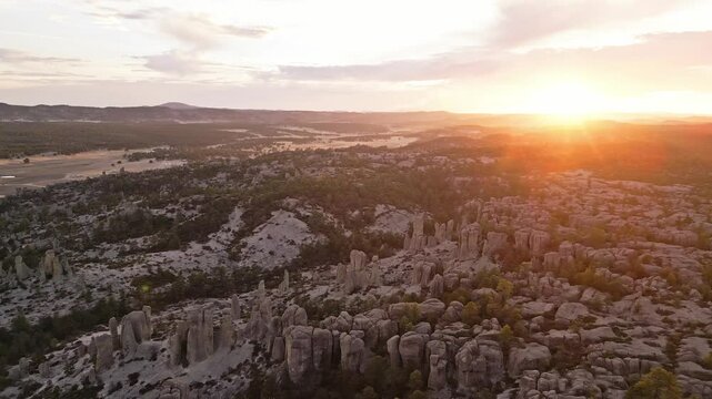 Golden hour light illuminates the stunning rock formations in Valle de los Monjes, Chihuahua