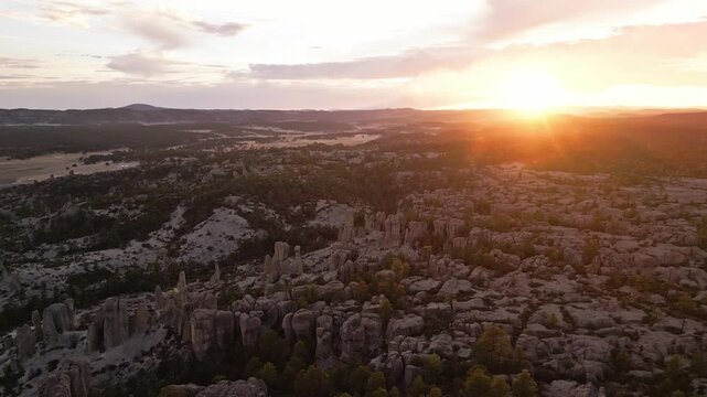 Sunset over rocky landscape with unique rock formations in Valle de los Monjes, Chihuahua