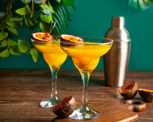 Fresh passion fruit maracuja alcoholic cocktail with ice cubes