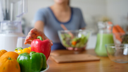 Close up of young woman preparing a nutritious meal in her kitchen..Healthy lifestyle concept