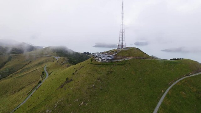Panoramic drone shot circling the radio transmitter on Te Heru o Kahukura in NZ