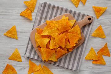 Mexican Nacho Cheese Tortilla Chips on a Board, top view.